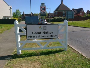 painting the Great Notley village sign